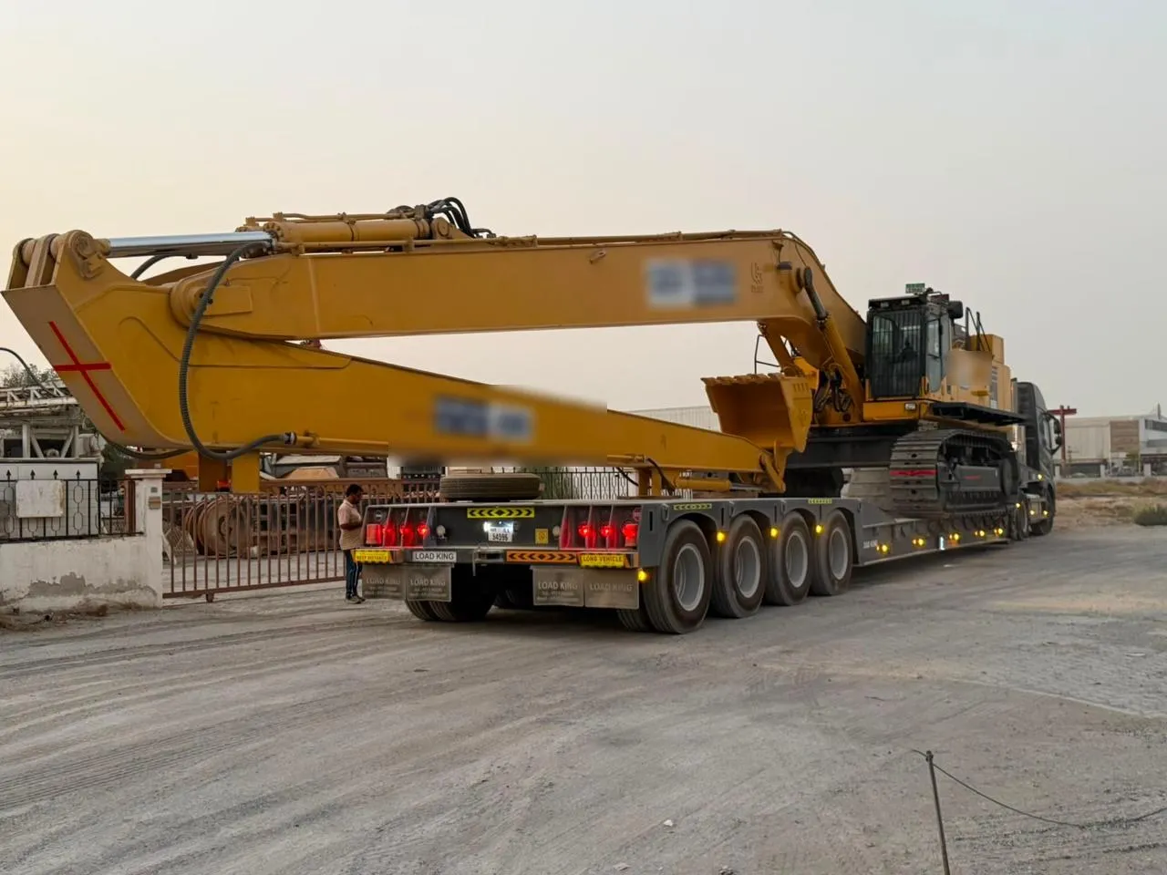 Komatsu PC850 long-reach excavator secured on an EQP AXIS lowbed trailer in Dubai
