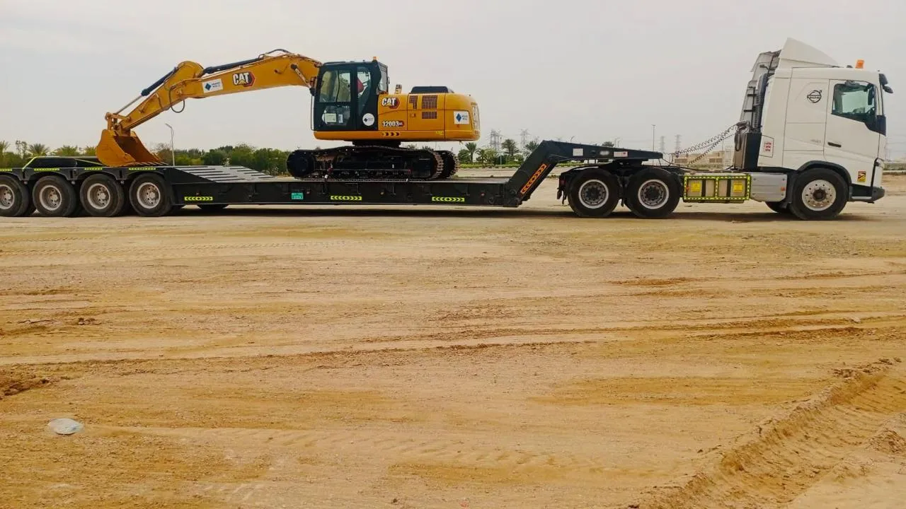 EQP AXIS trailer loaded with heavy plant for transport across Dubai