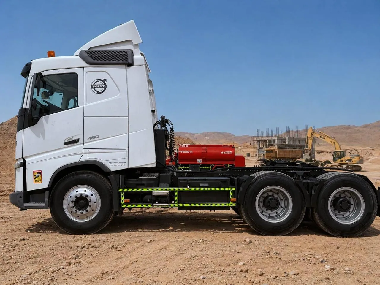 White Volvo FH 460 6x4 prime mover in side profile at a UAE construction site