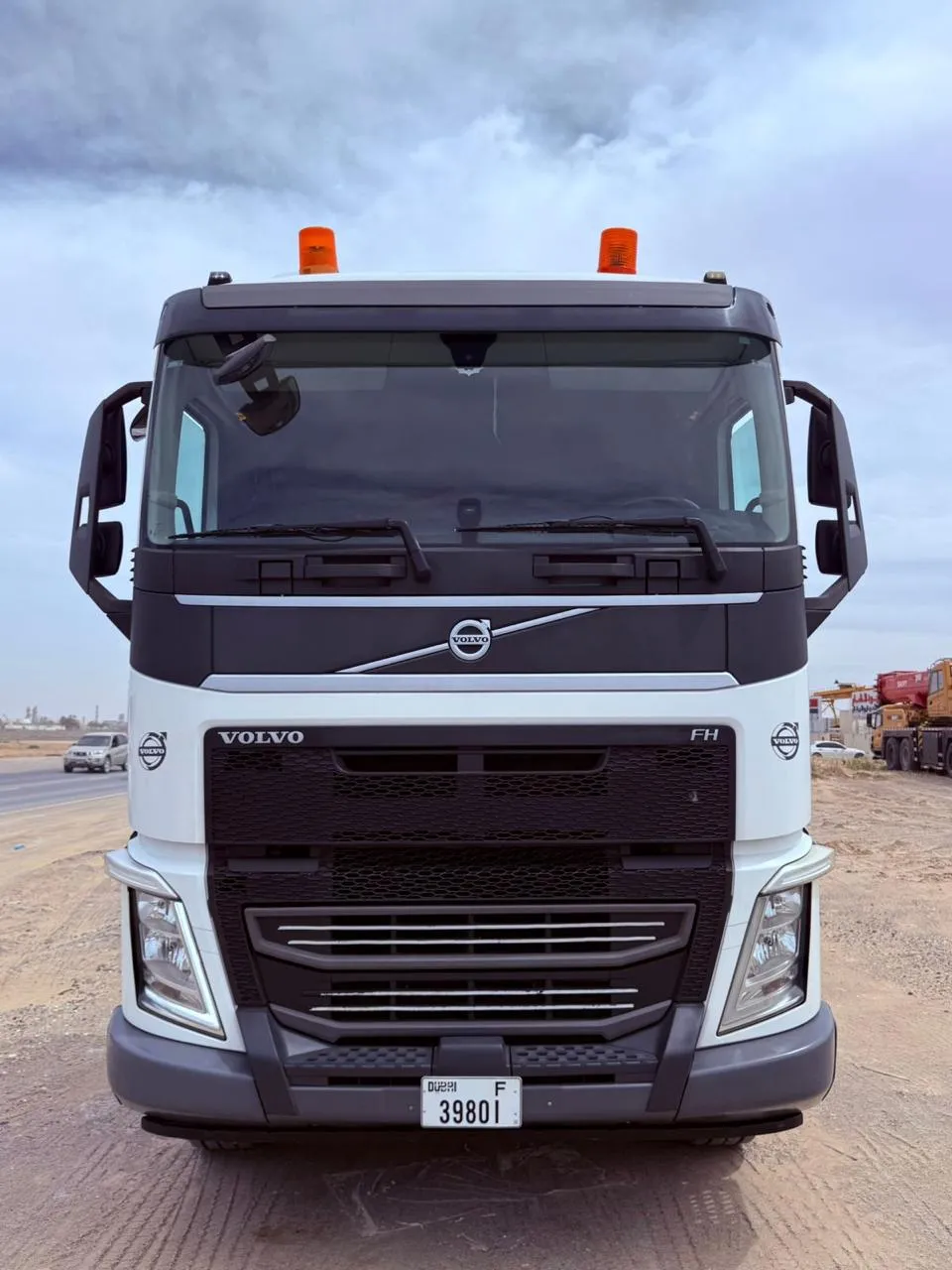 Front view of a white Volvo FH prime mover staged for dispatch in the UAE