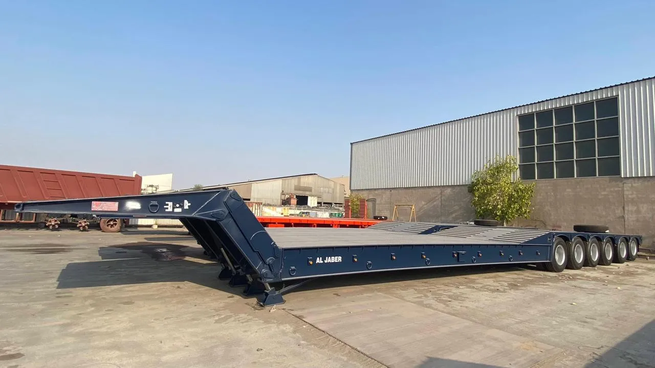 Navy Al Jaber 6-axle hydraulic low-bed trailer parked in the equipment yard